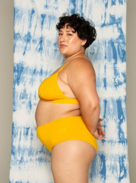 Side of kowhai yellow hana high waisted bamboo underwear. Bare boutique